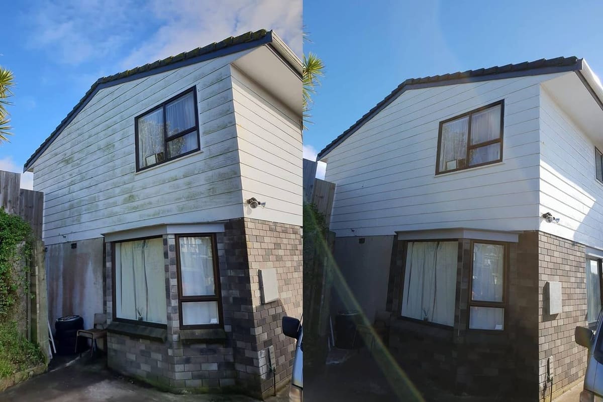 Wellington house wash before and after, two-storey weatherboard home with a dramatic green mould band across the upper storey before, clean white weatherboard after a soft-wash with biocide chemistry