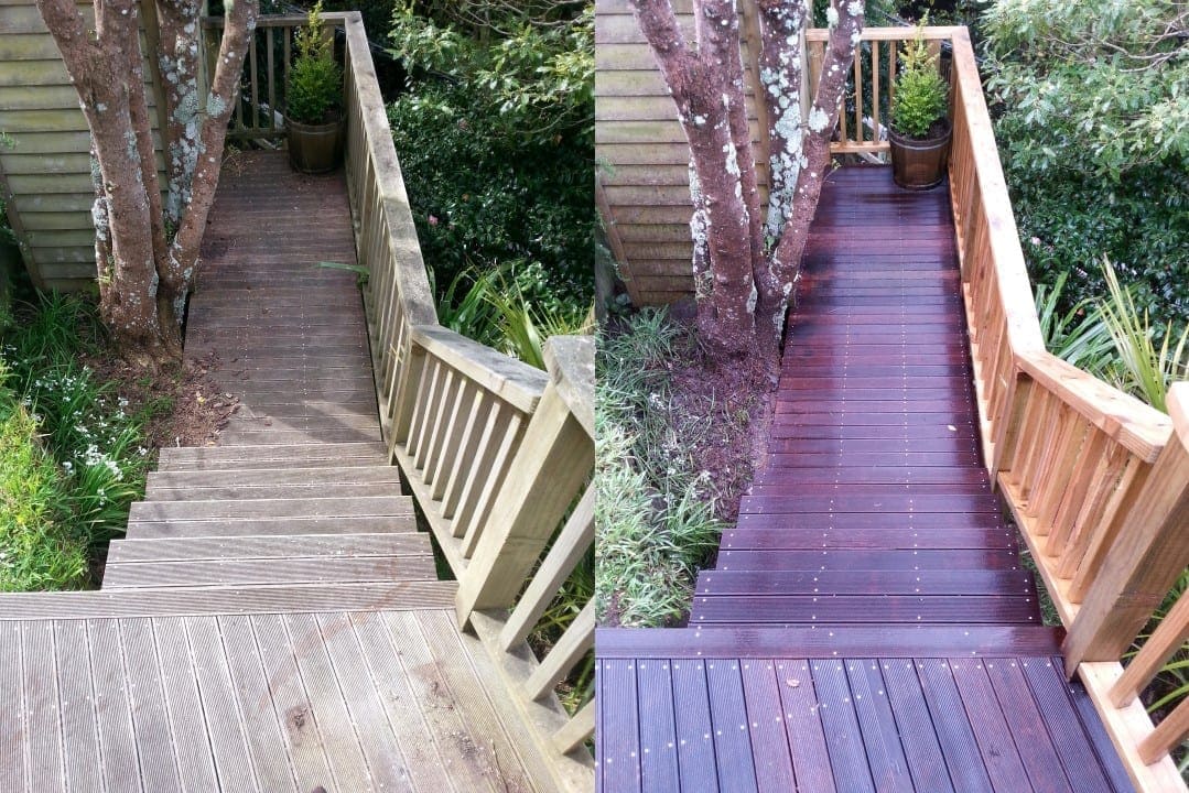 Wellington timber step restoration before and after, weathered grey timber steps and walkway threading through a hillside garden, dark-stained warm timber after restoration